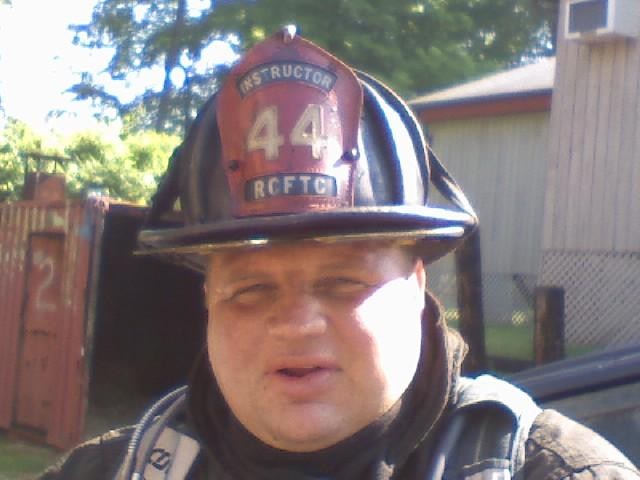 2nd Assistant Chief AJ Knapp during NYS Firefighter 2 class.  The red shield on his helmet indicates that he is an INSTRUCTOR.  FTC, 6/1/08