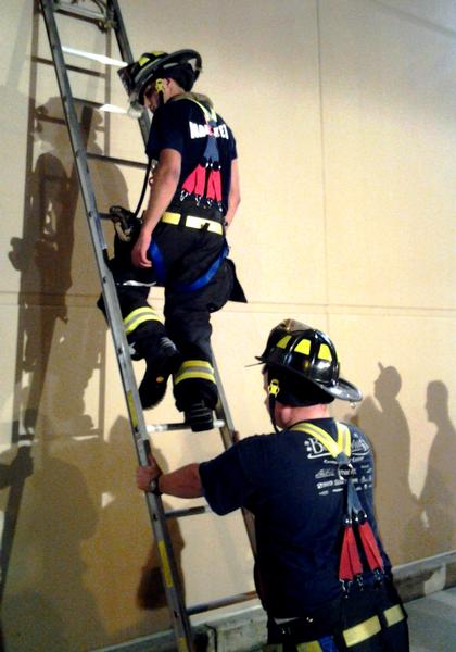 Back to Basic. Brushing up on placing ladders. Training save lives. 8/25/2014.
Photo by Vincent P. Tuzzolino
