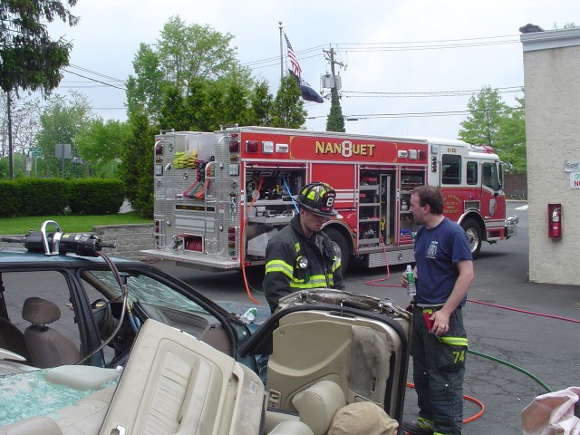 FF Joe Koester and than Captain Mike Mattera.  Jaws of Life drill with 8-EQ, 5/15/05